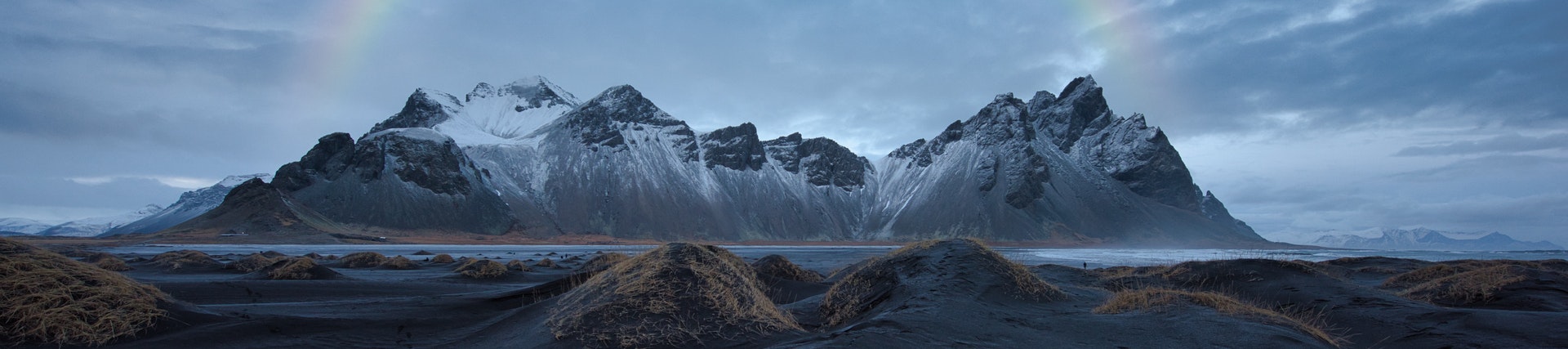 photo-of-mountain-under-cloudy-sky